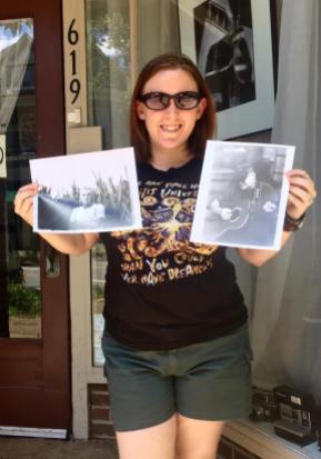 amanda with two film print portraits made in dark room